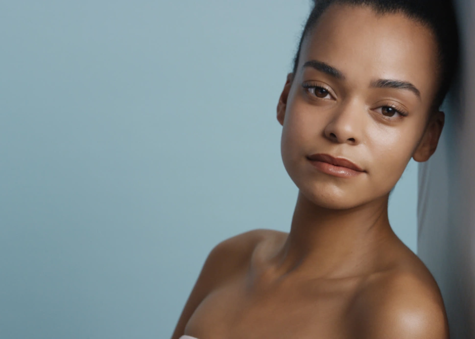 Portrait of a woman with even, revitalized skin